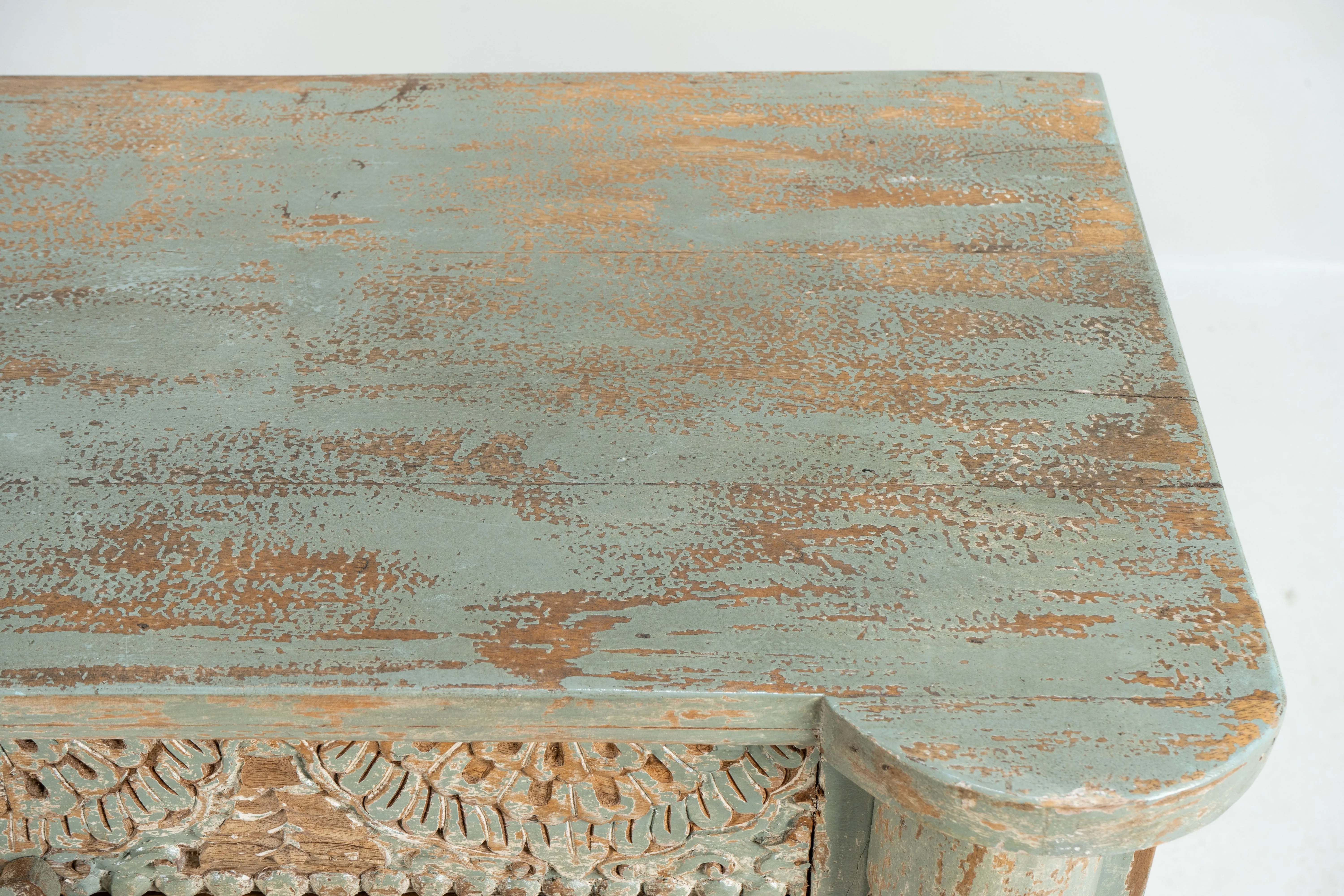 A Wooden Sideboard with Wooden Openwork Doors
