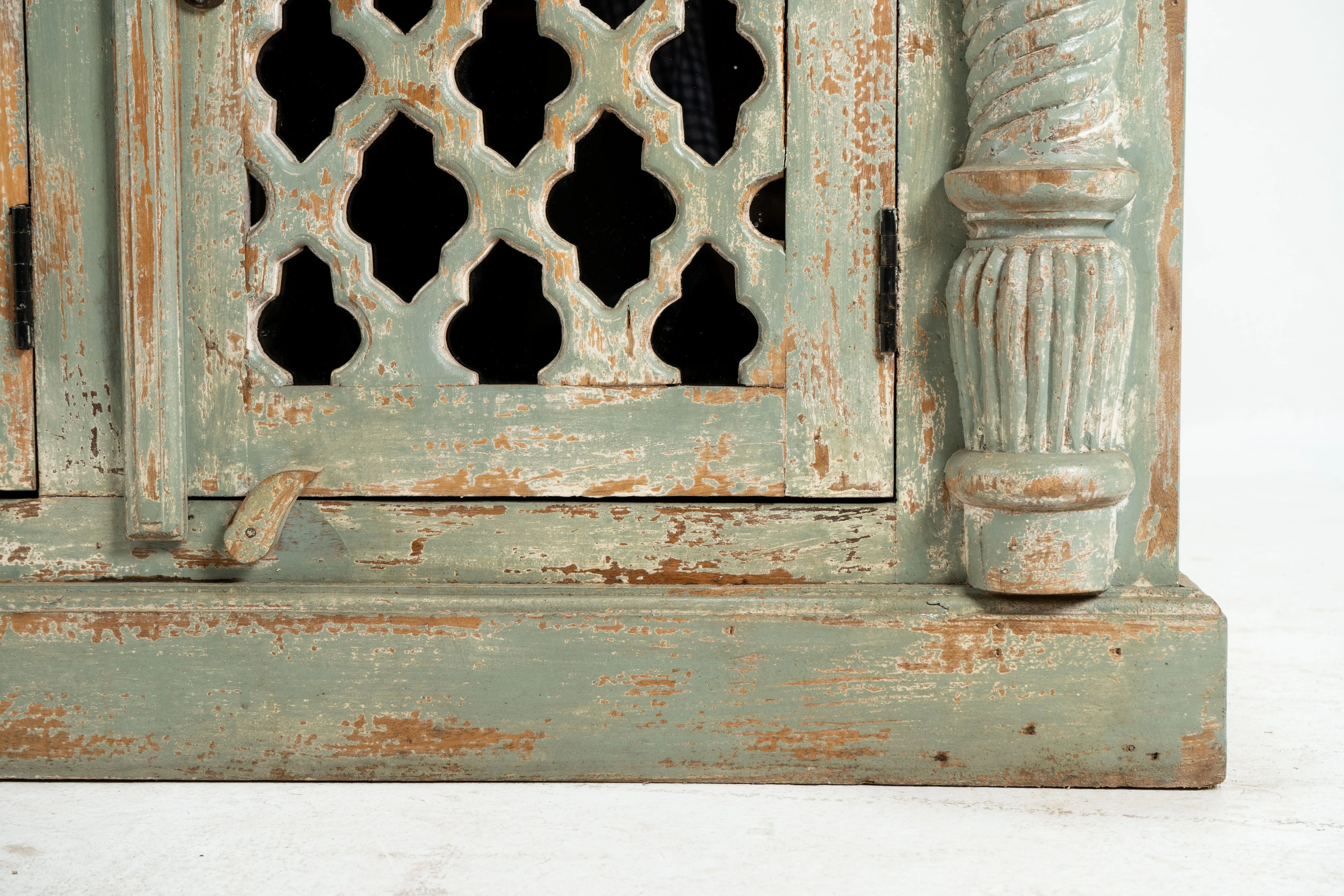 A Wooden Sideboard with Wooden Openwork Doors