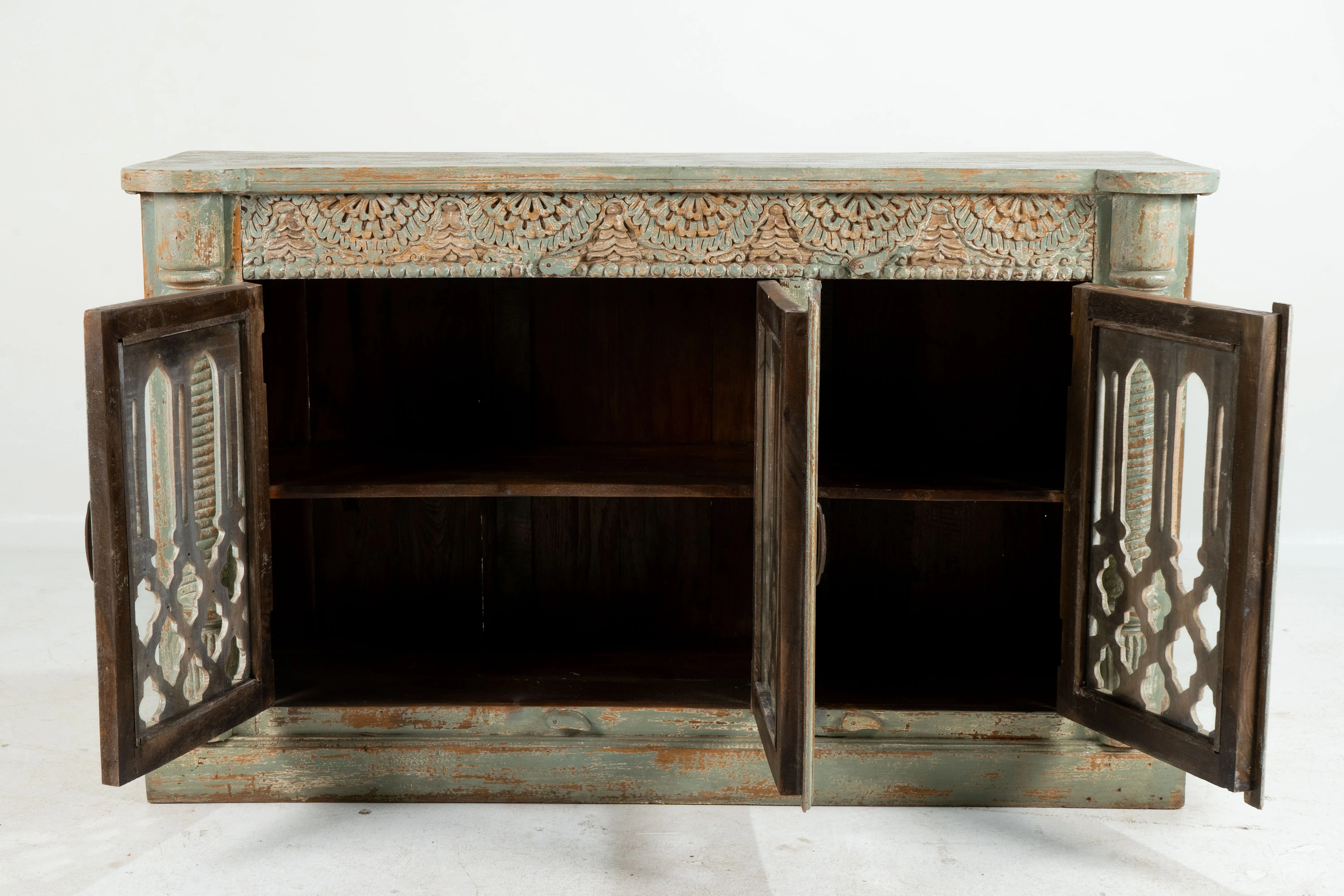A Wooden Sideboard with Wooden Openwork Doors