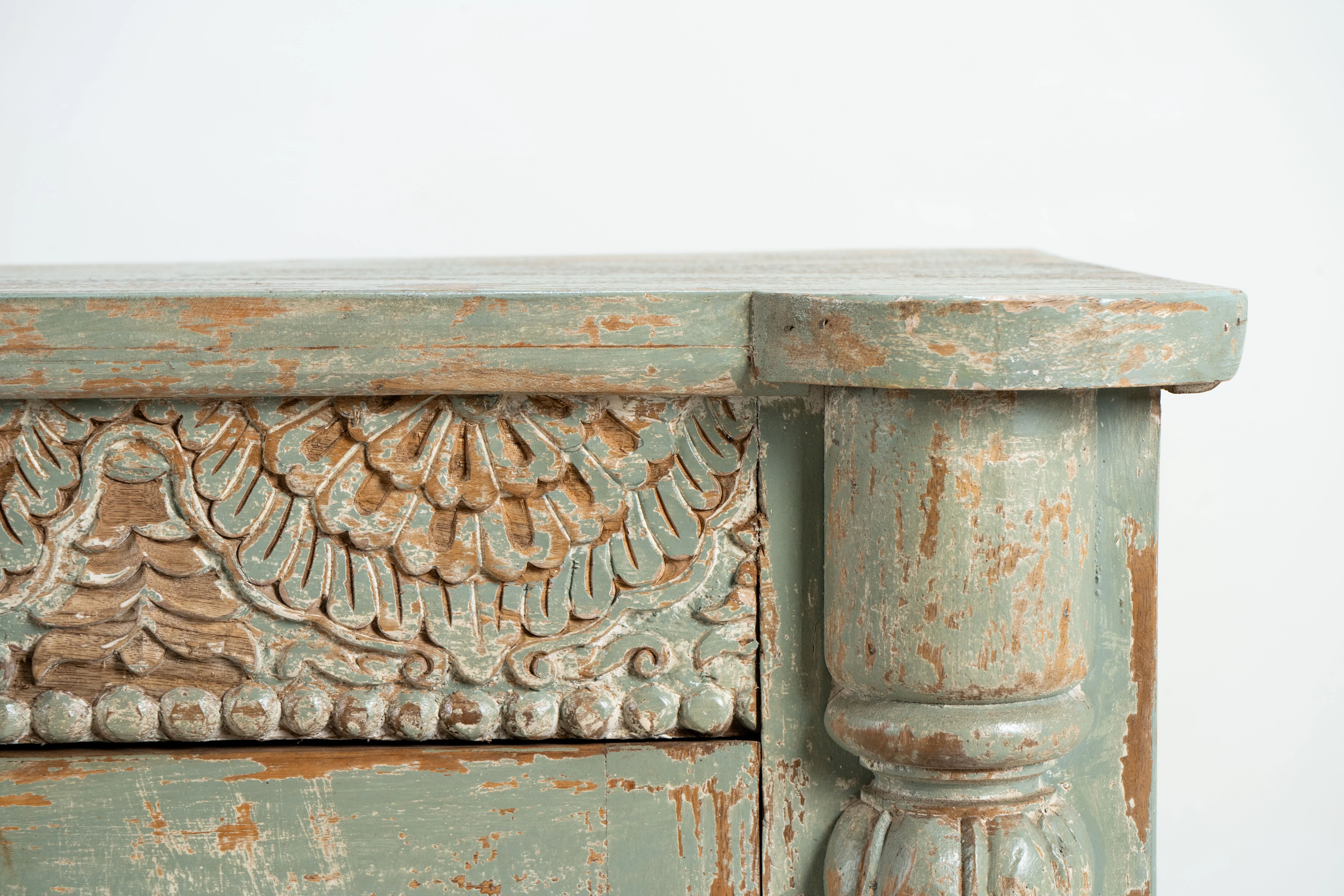A Wooden Sideboard with Wooden Openwork Doors