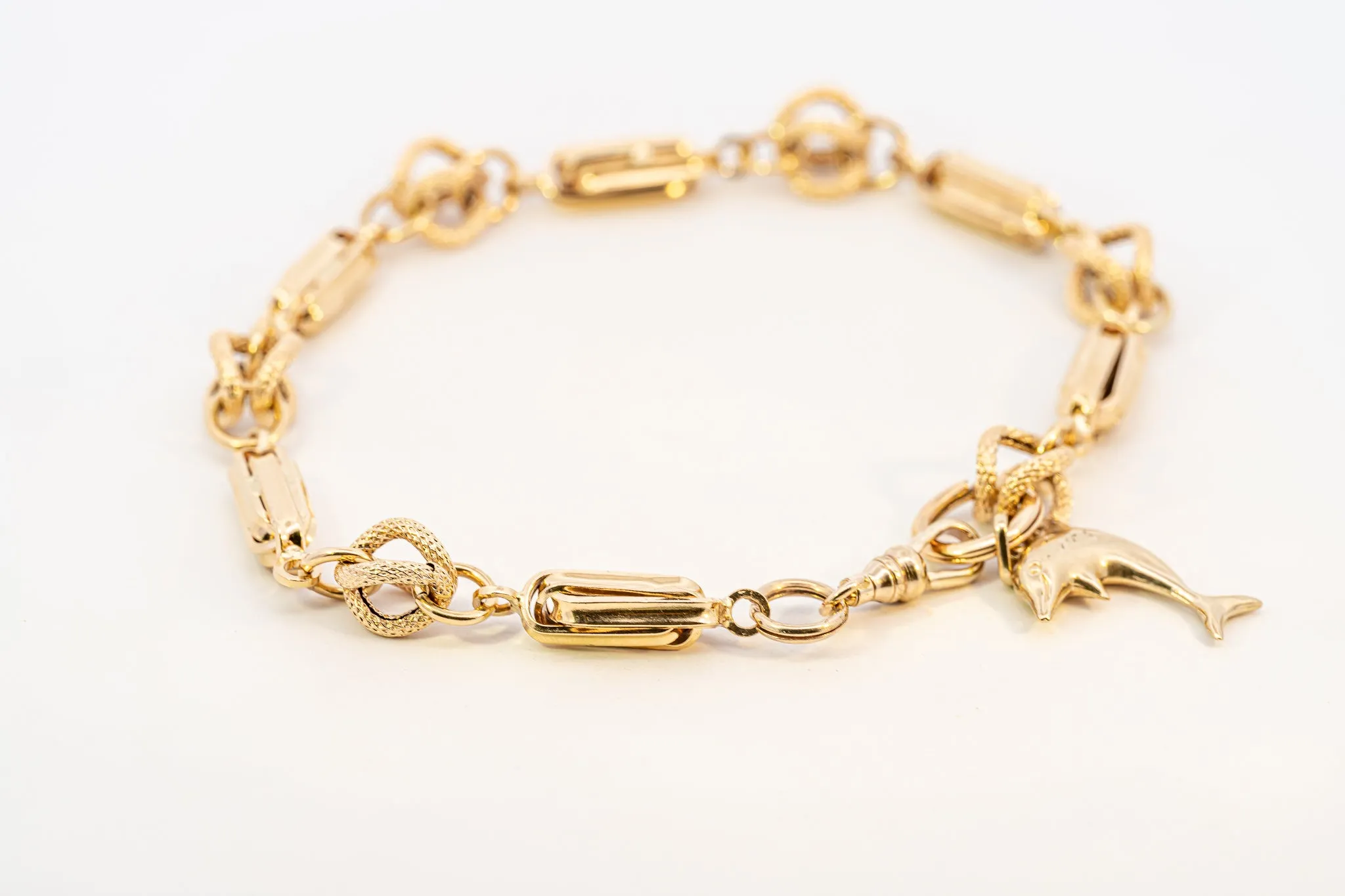 An Exquisite Gold Bracelet with Dolphin Charm, that's Beyond Ordinary!