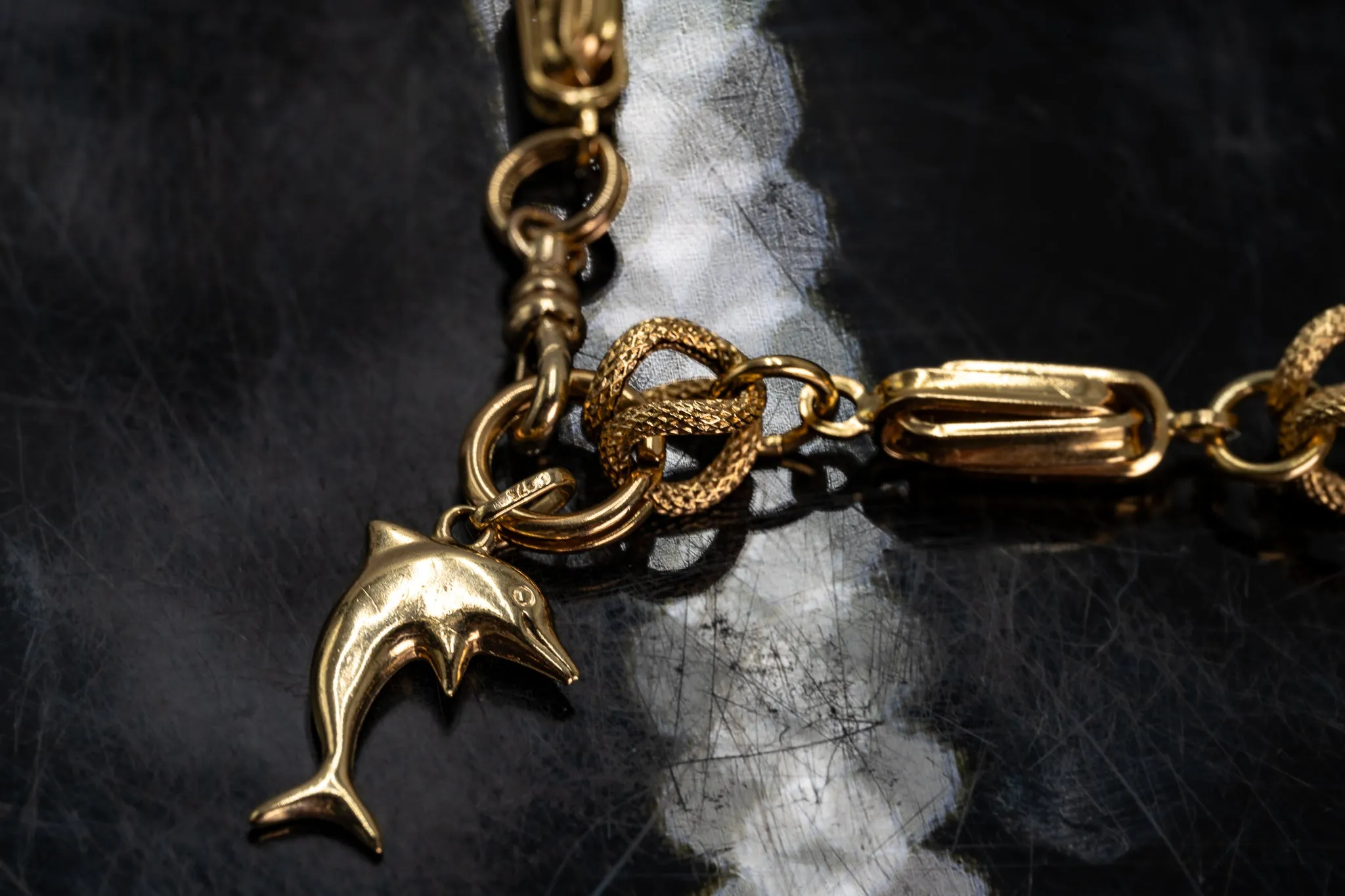 An Exquisite Gold Bracelet with Dolphin Charm, that's Beyond Ordinary!