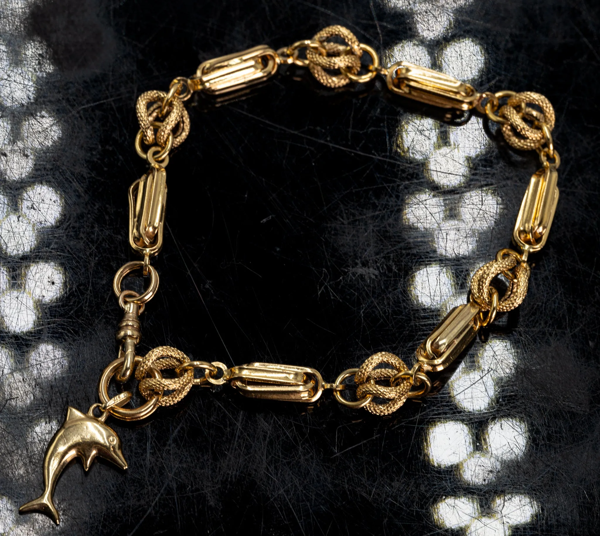 An Exquisite Gold Bracelet with Dolphin Charm, that's Beyond Ordinary!