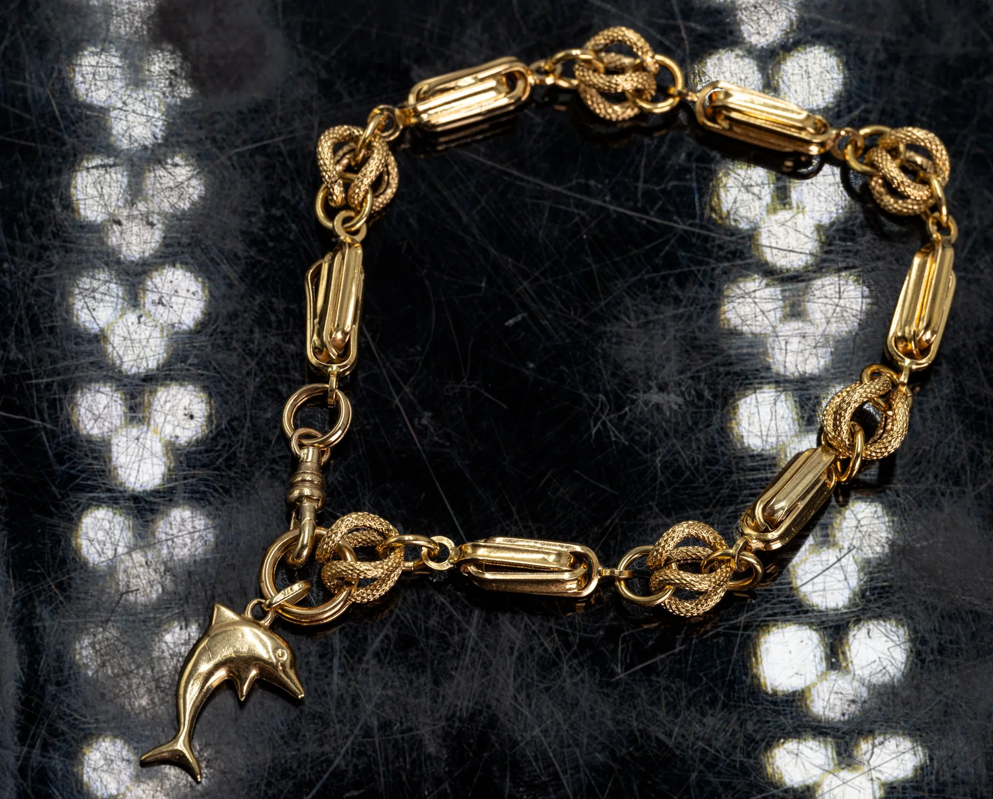 An Exquisite Gold Bracelet with Dolphin Charm, that's Beyond Ordinary!