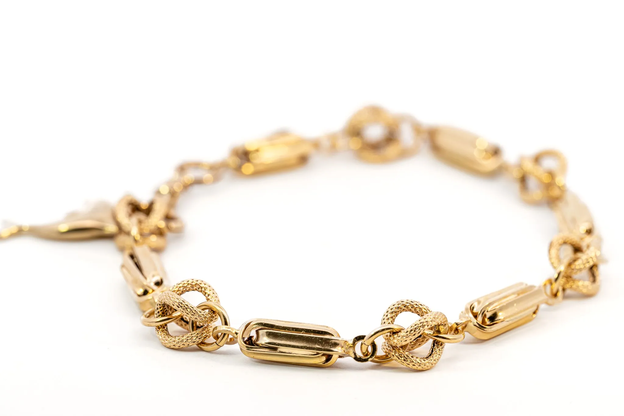 An Exquisite Gold Bracelet with Dolphin Charm, that's Beyond Ordinary!
