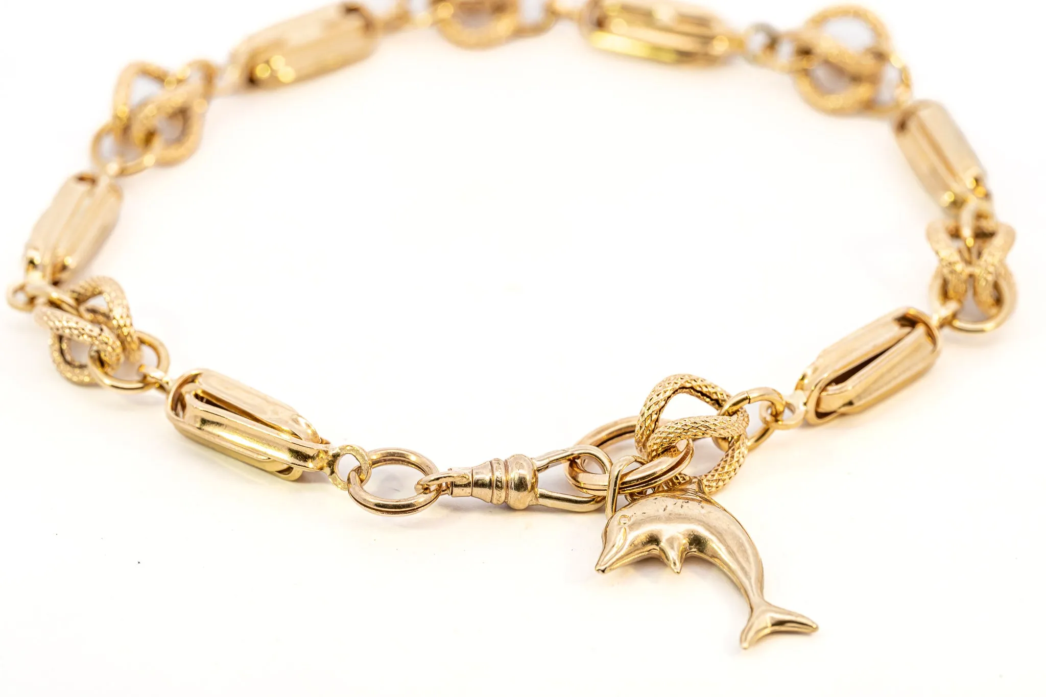 An Exquisite Gold Bracelet with Dolphin Charm, that's Beyond Ordinary!