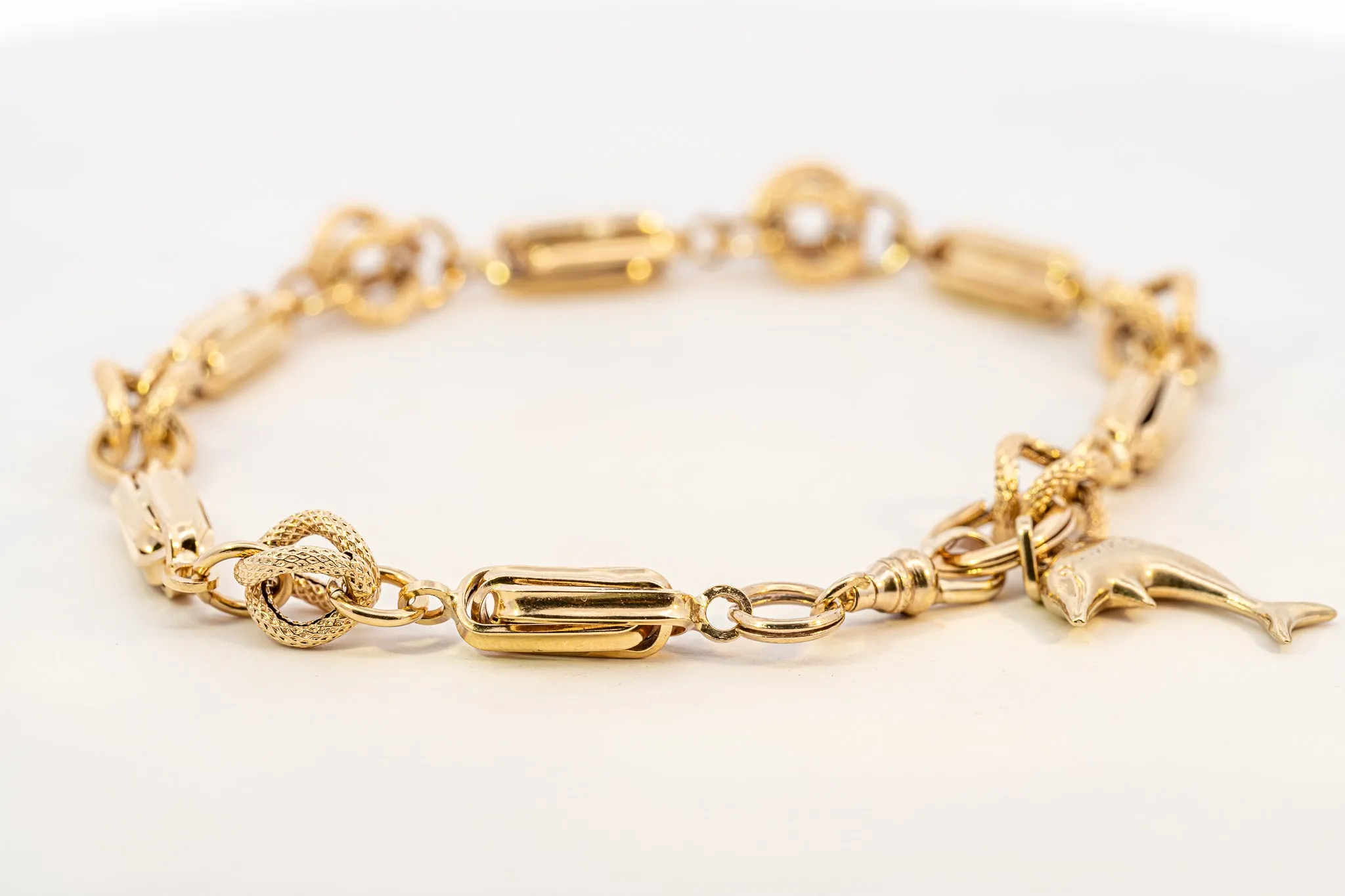 An Exquisite Gold Bracelet with Dolphin Charm, that's Beyond Ordinary!