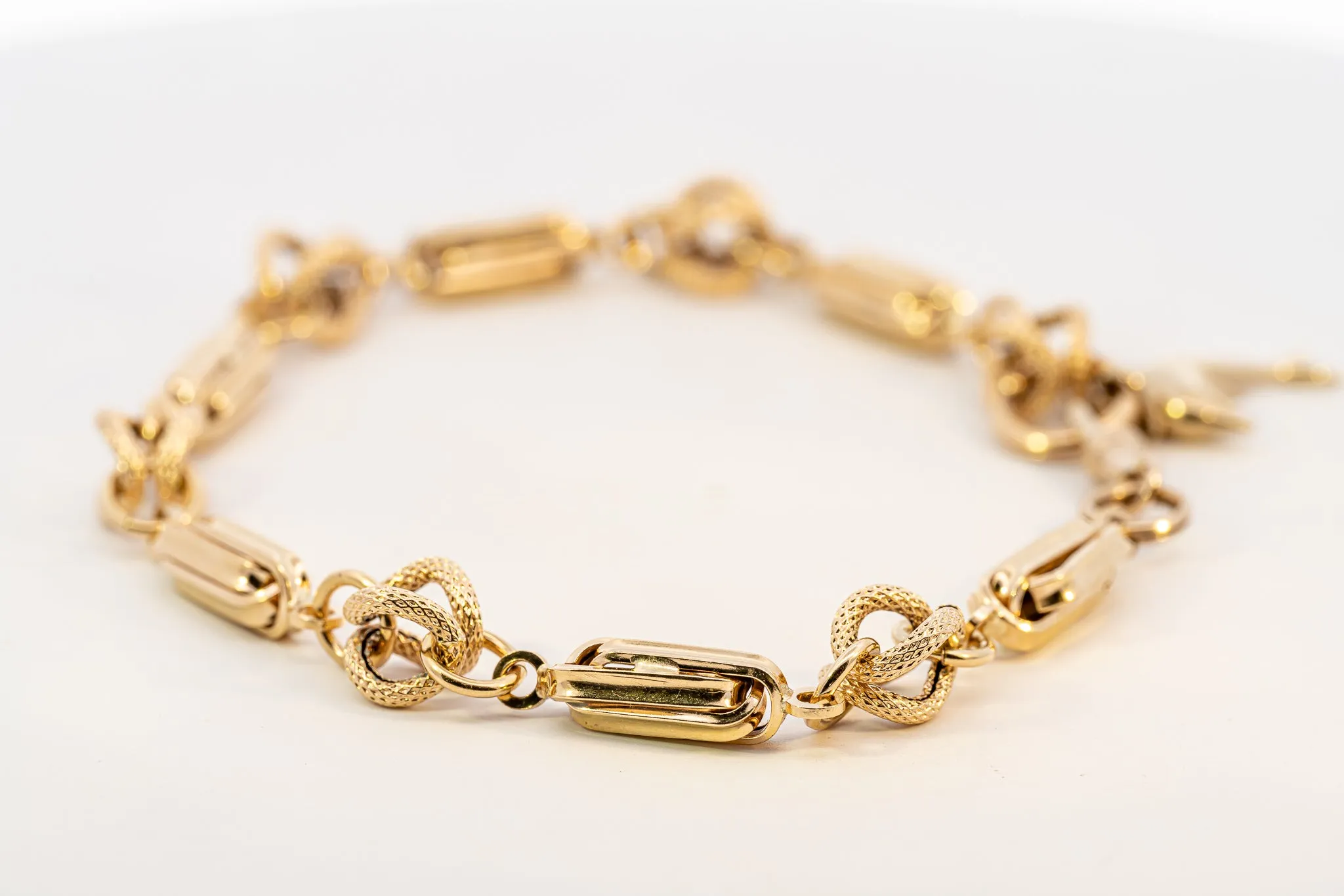 An Exquisite Gold Bracelet with Dolphin Charm, that's Beyond Ordinary!