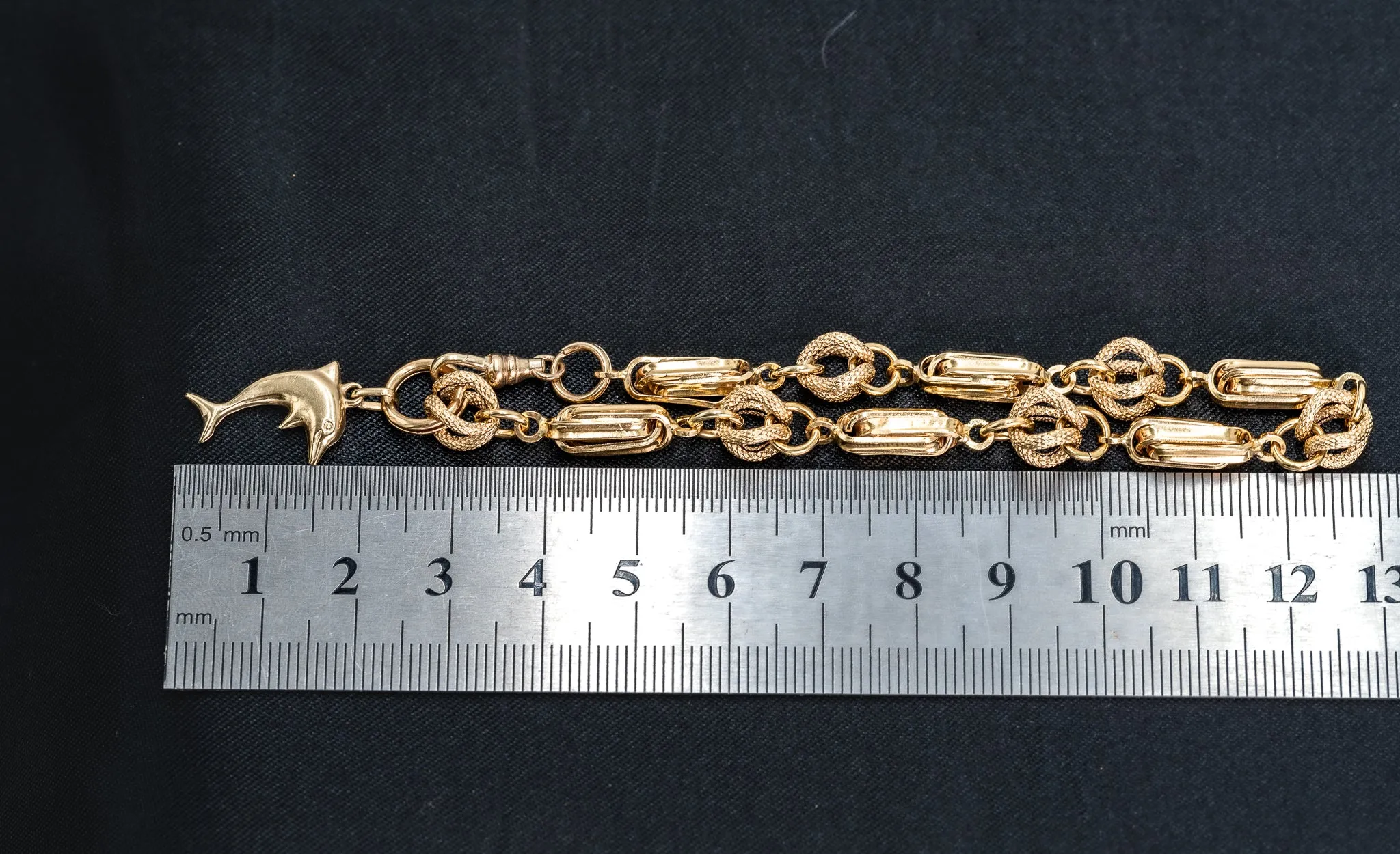 An Exquisite Gold Bracelet with Dolphin Charm, that's Beyond Ordinary!