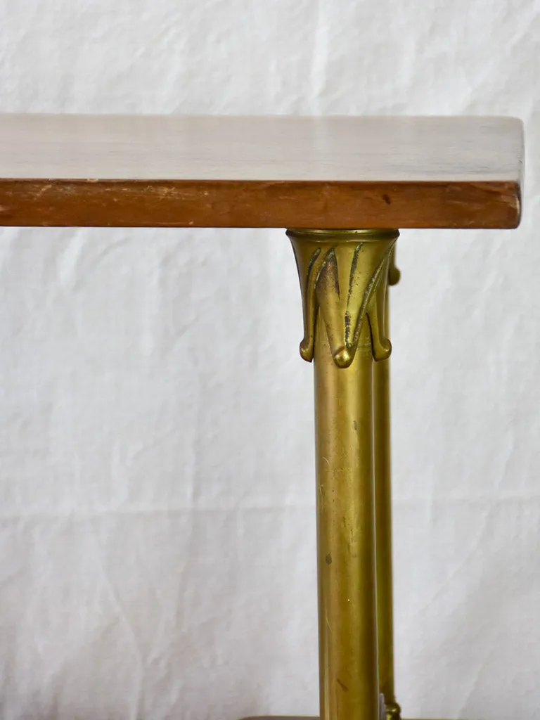 Early twentieth century shelving unit with bronze frame from a boutique 32¼"
