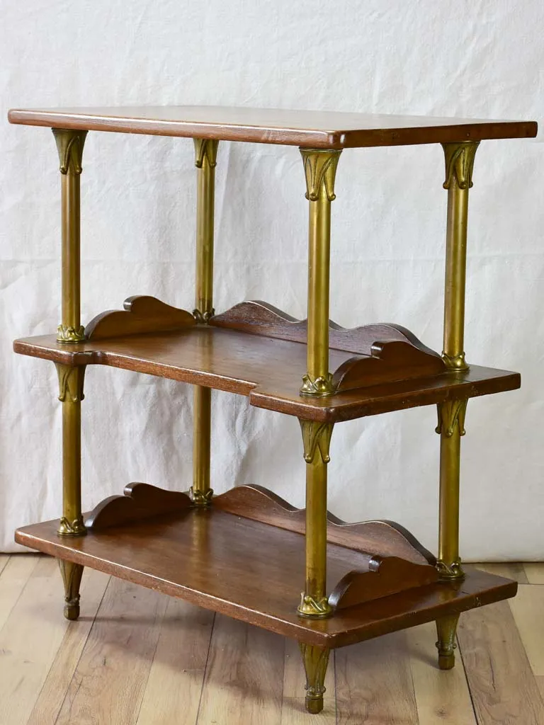 Early twentieth century shelving unit with bronze frame from a boutique 32¼"