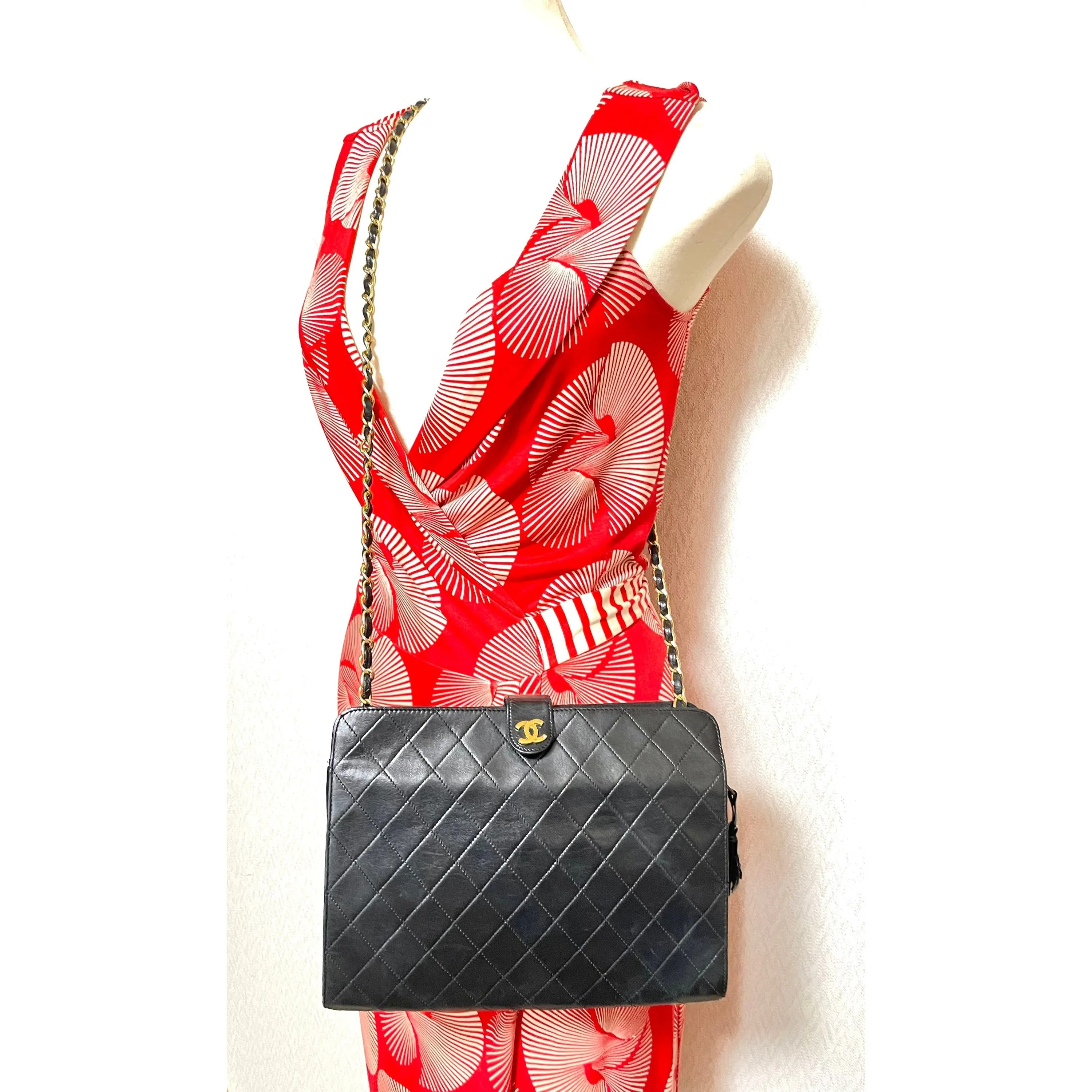 Vintage CHANEL black leather diary book design 2.55 flap shoulder bag with gold tone CC closure. 0407232